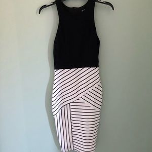 Black mid-length, almost to the knee dress.